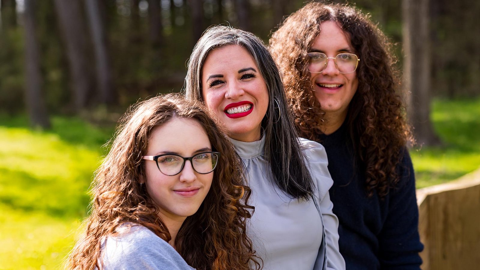 Smiling mother with her teen daughter and son for a holiday card family photo in Southeast Michigan